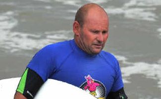 Heating up: Scott Schindler heads back to dry land on Sawtell Beach after winning his over-28 mens heat at the Barney Miller Surf Classic. Heating up: Scott Schindler heads back to dry land on Sawtell Beach after winning his over-28 mens heat at the Barney Miller Surf Classic.